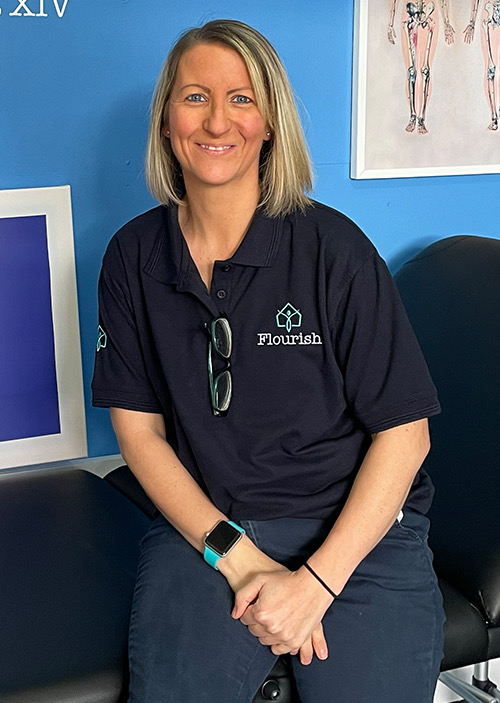 Samantha Mann, chartered physiotherapist, smiling in the Flourish clinic